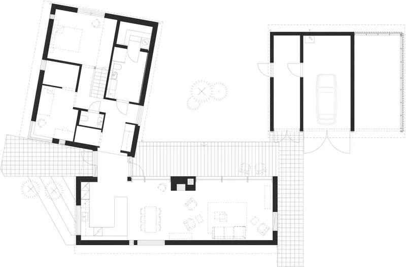Floor plan drawing showing three interconnected structures with living spaces and a detached garage