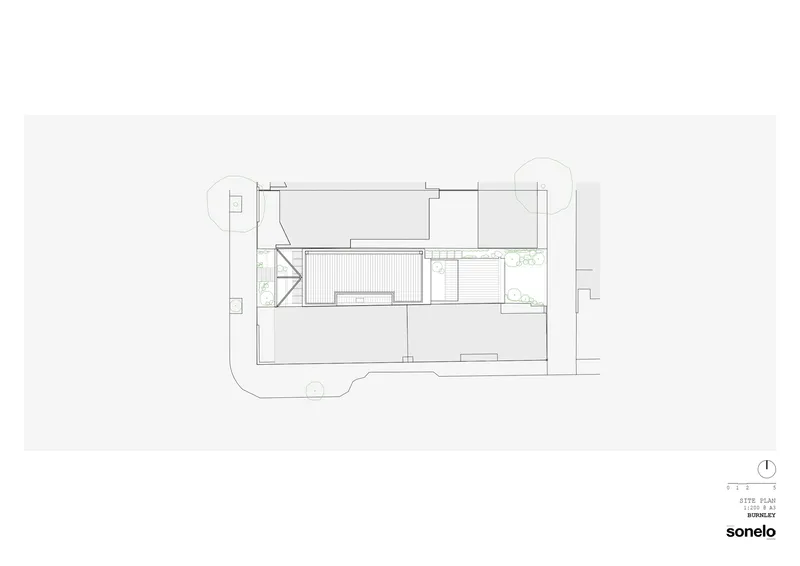 Site plan drawing showing building footprint with courtyard and surrounding landscape elements