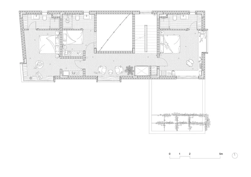 Floor plan drawing showing two bedrooms flanking a central void with terrace below