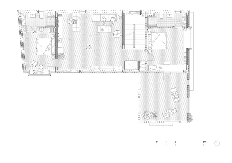 Floor plan drawing showing L-shaped layout with two bedrooms and courtyard terrace
