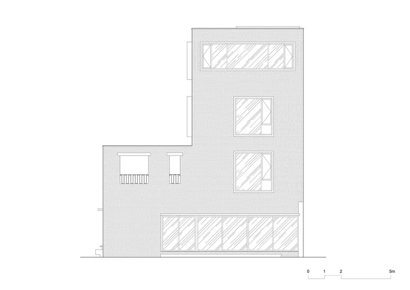 Elevation drawing of brick facade with varied window openings across three stories