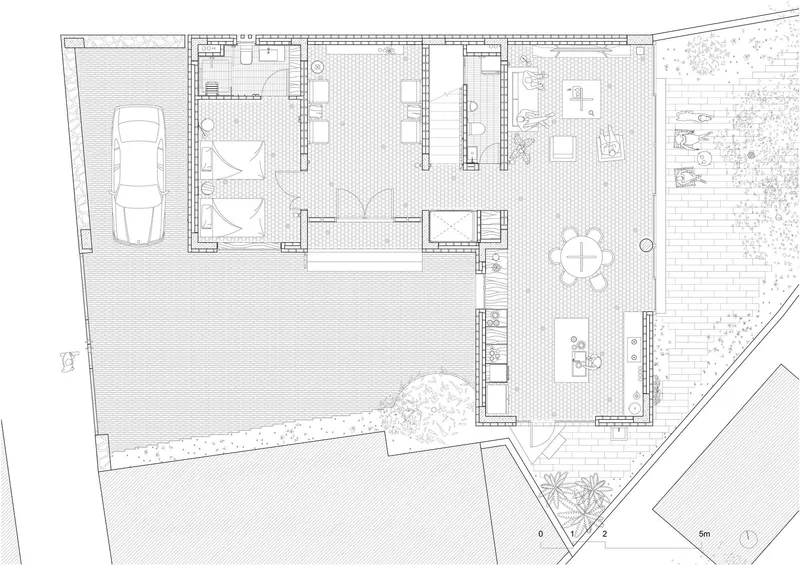 Ground floor plan drawing showing garage, living areas, courtyard, and planted garden zones
