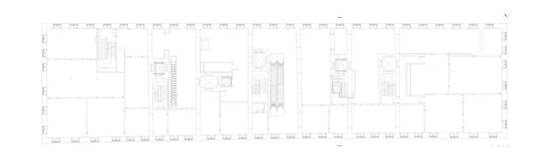 Floor plan drawing revealing open volumes divided by vertical circulation elements and service areas