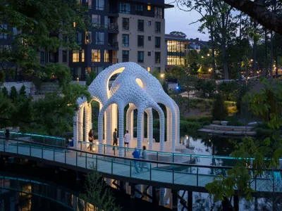 Marc Fornes Floats a Perforated Aluminum Folly on a Pond in Downtown Cary