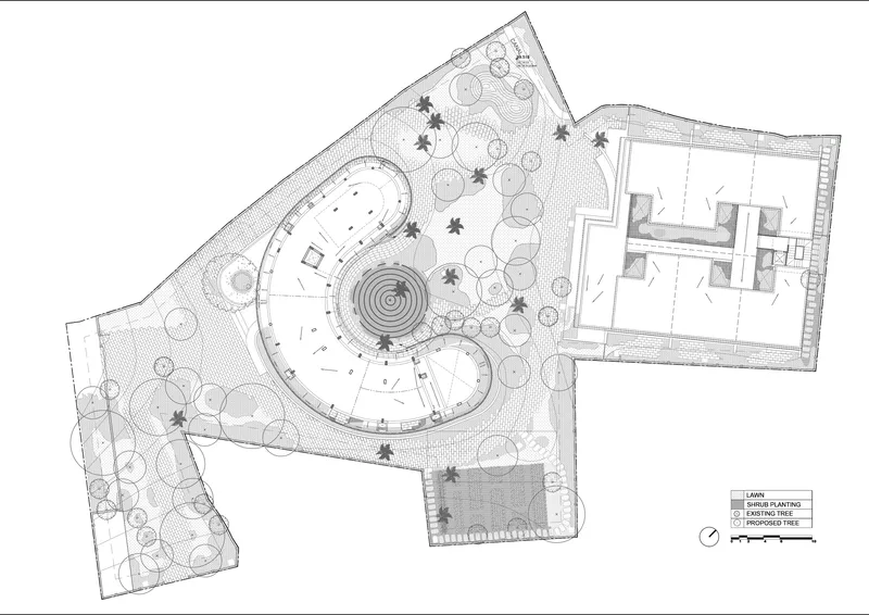 Landscape plan showing curved building forms surrounded by trees and circular planting beds