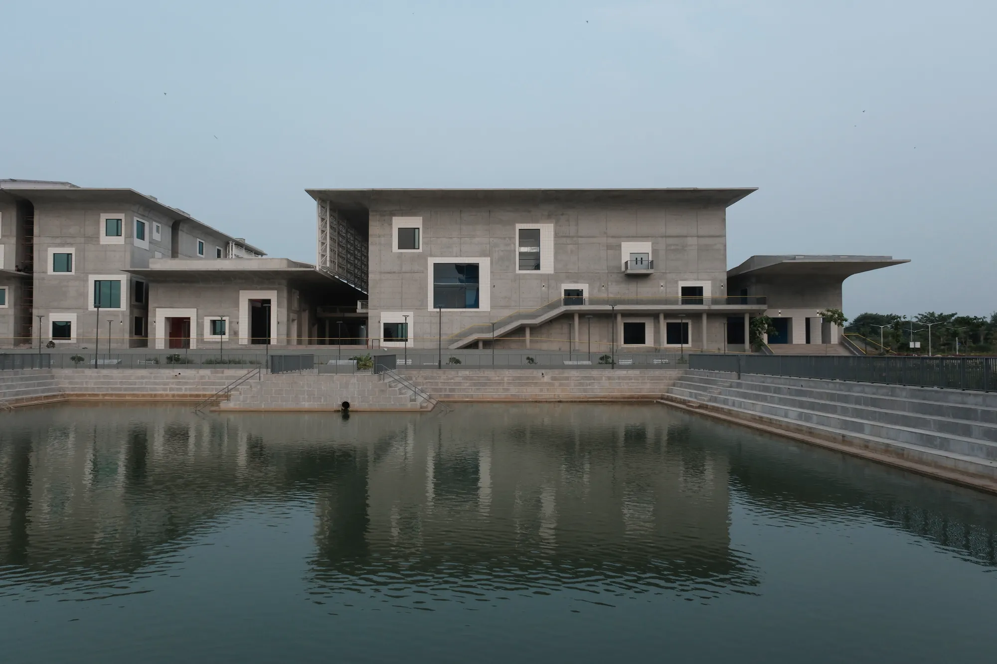 Three Studios from Tokyo and Hyderabad Build a Convention Center of Curved Concrete and Courtyards
