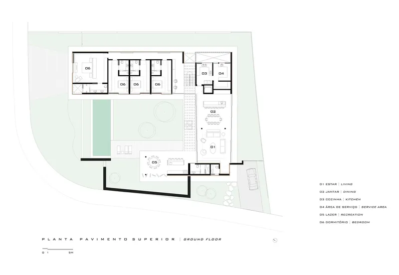 Ground floor plan drawing showing living, dining, kitchen, and bedroom spaces around central courtyard