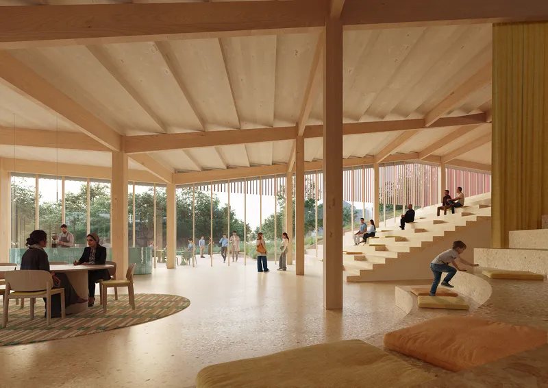 Interior hall with exposed timber beams and sculptural stone staircase occupied by seated figures