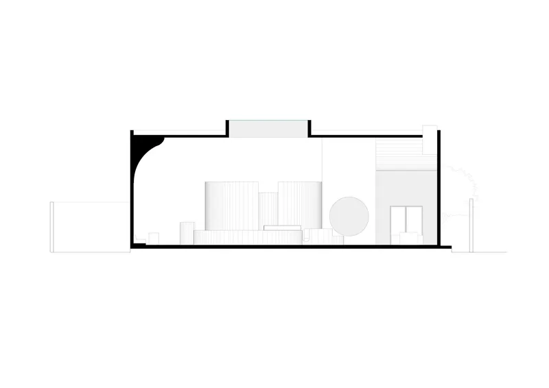 Section drawing showing interior spatial arrangement with curved wall element and furniture layout