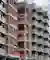 Studio Frozen Music Replaces a Generic Nashik Tower with a Stepped Brick and Concrete Housing Block