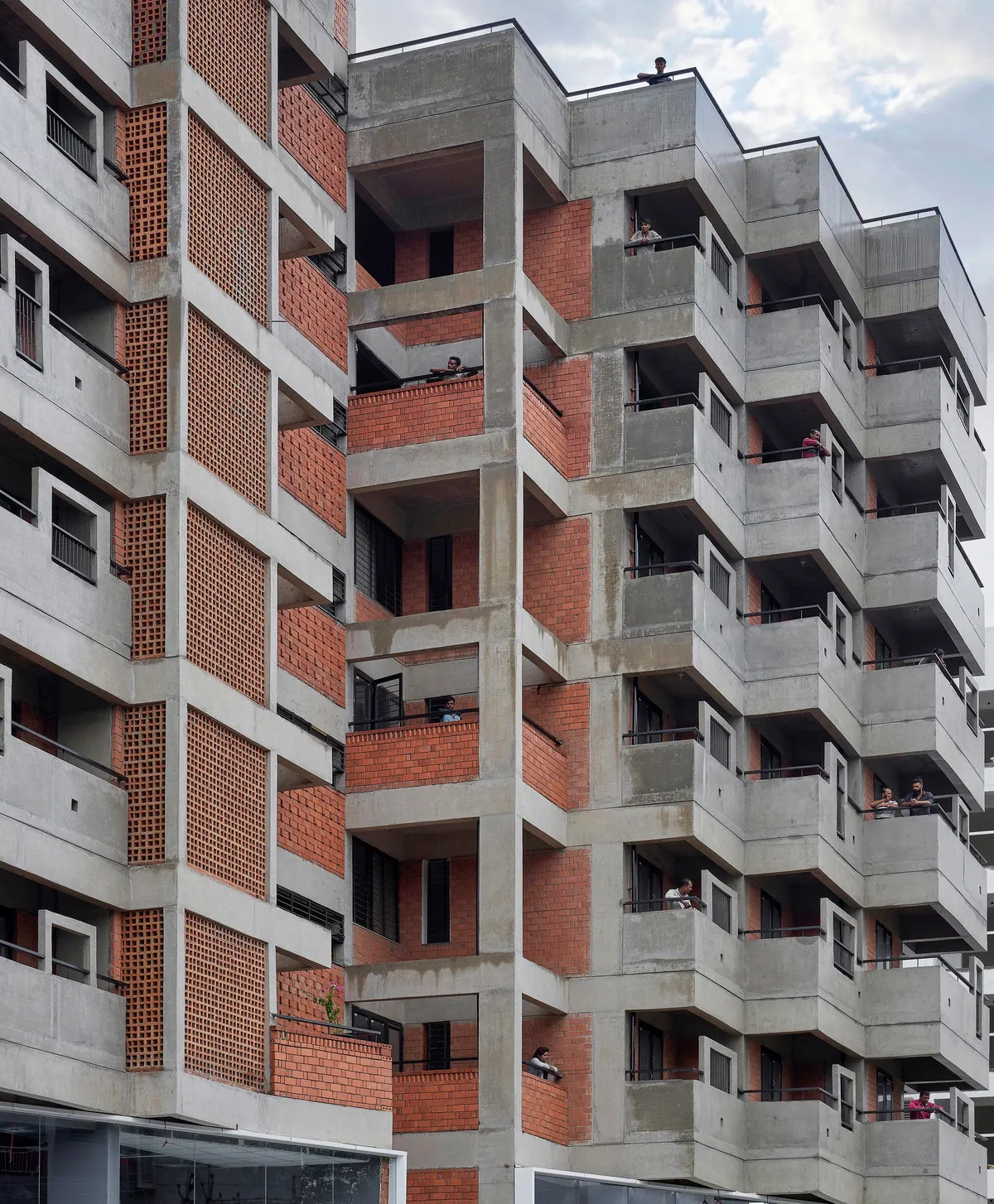 Studio Frozen Music Replaces a Generic Nashik Tower with a Stepped Brick and Concrete Housing Block