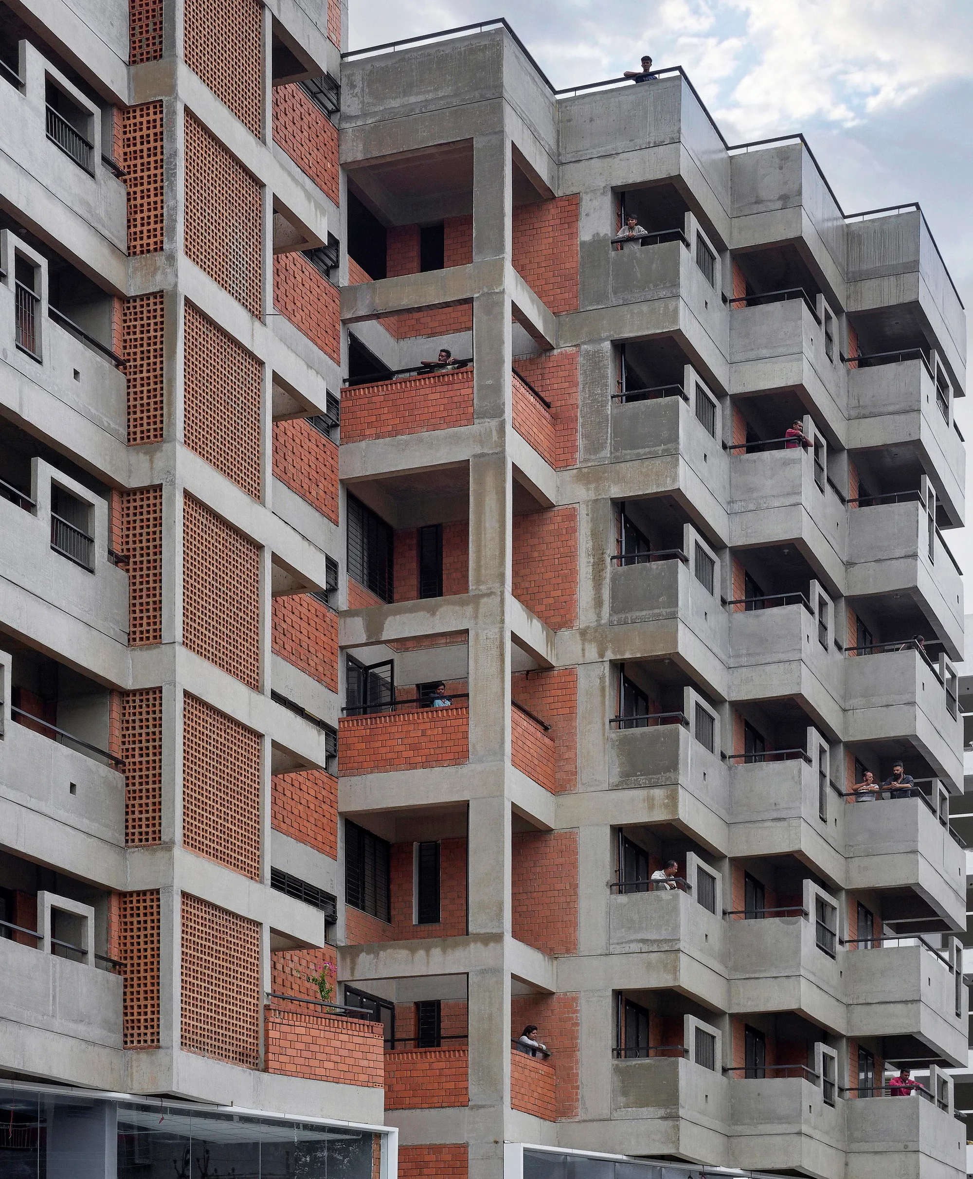 Studio Frozen Music Replaces a Generic Nashik Tower with a Stepped Brick and Concrete Housing Block