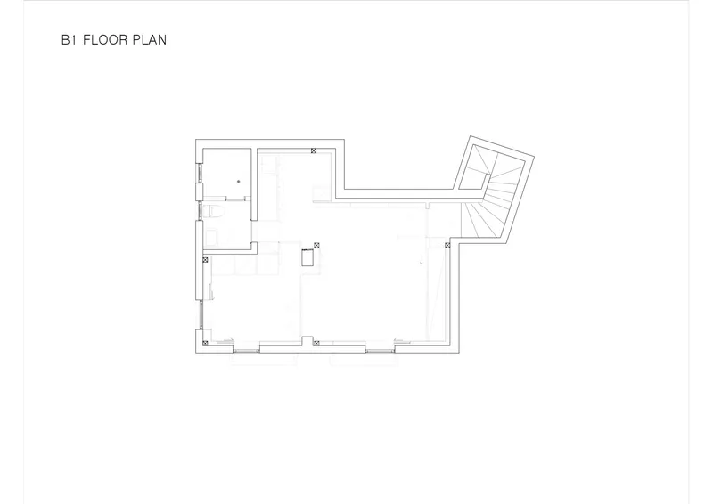 Floor plan drawing showing basement level with rectangular volume and angled stair projection