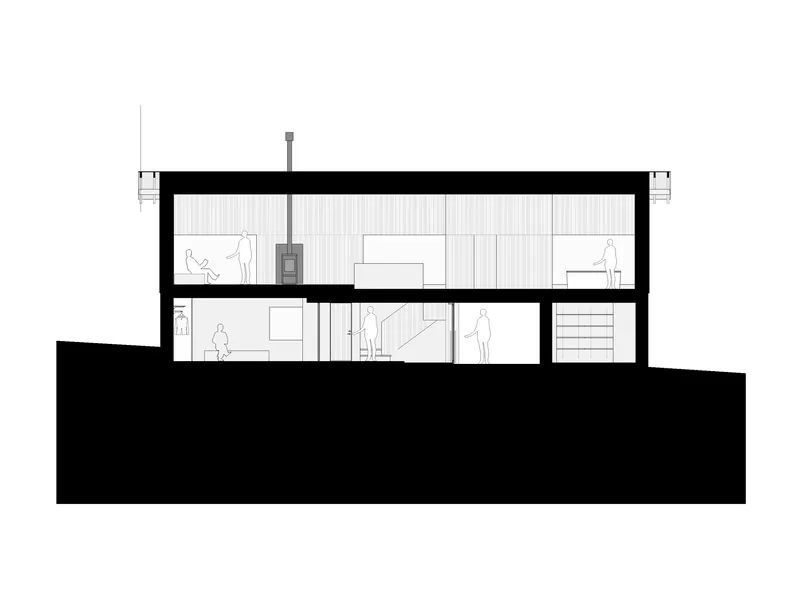 Section drawing showing two-story interior with central stove and stepped terrain