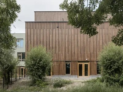 KRFT Architecture Builds a Timber Village for Children on a Dutch Canal in Hoorn