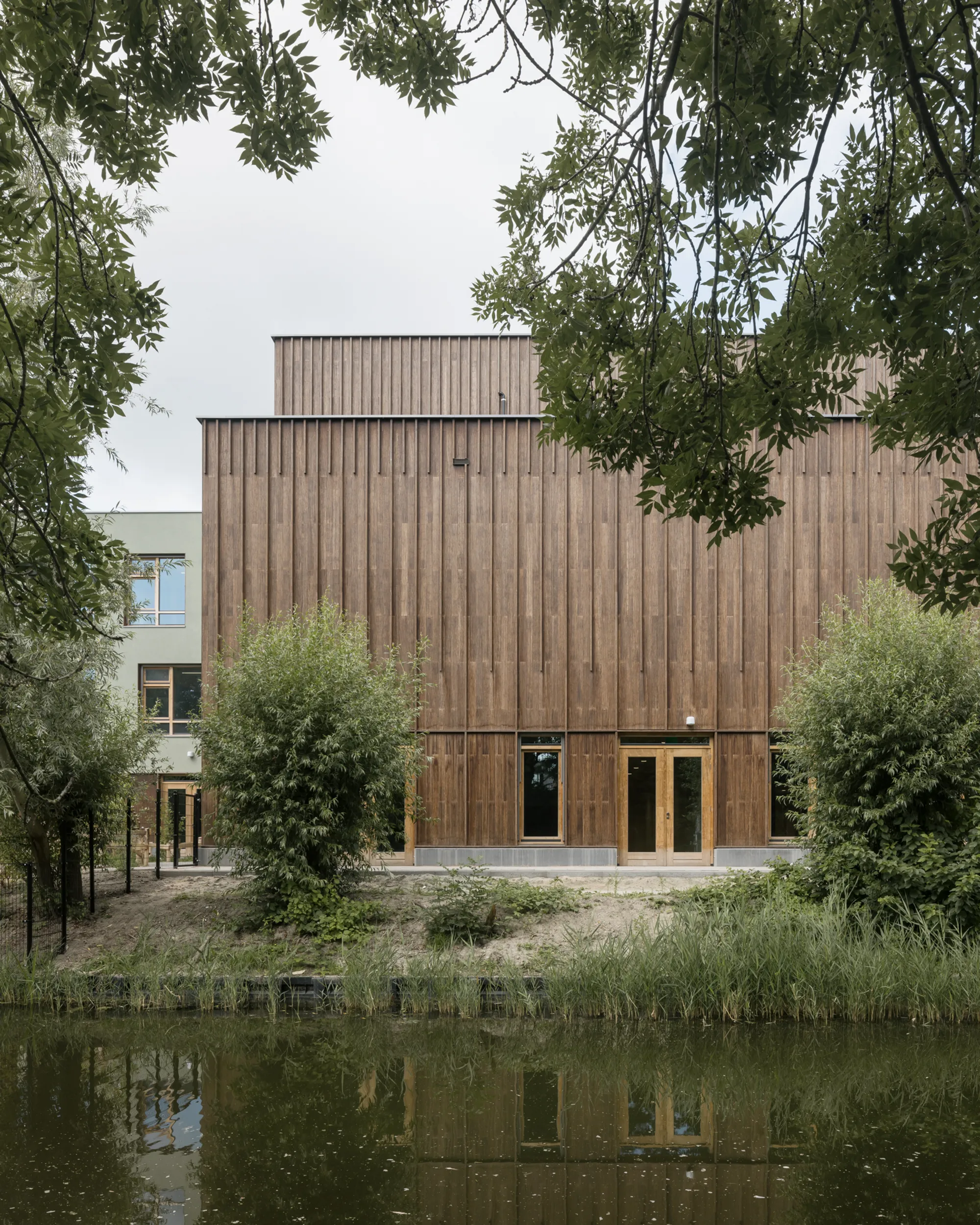 KRFT Architecture Builds a Timber Village for Children on a Dutch Canal in Hoorn