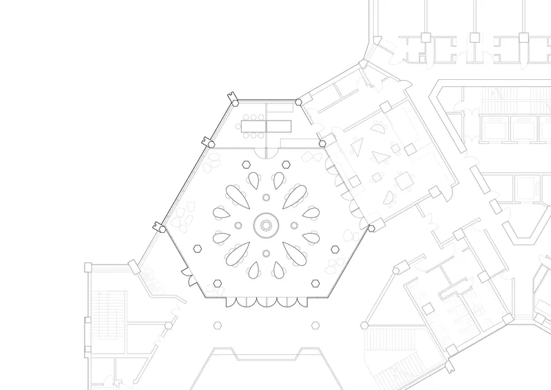 Floor plan drawing showing a hexagonal central volume with radial seating pattern and adjacent angular rooms