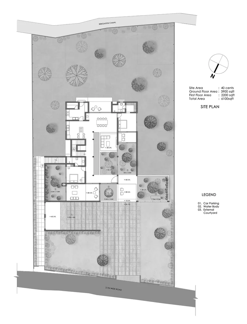Site plan drawing showing residence footprint with courtyards and tree canopies across the property