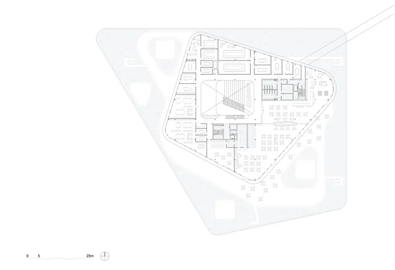 Floor plan drawing showing triangular perimeter with interior rooms and central atrium space