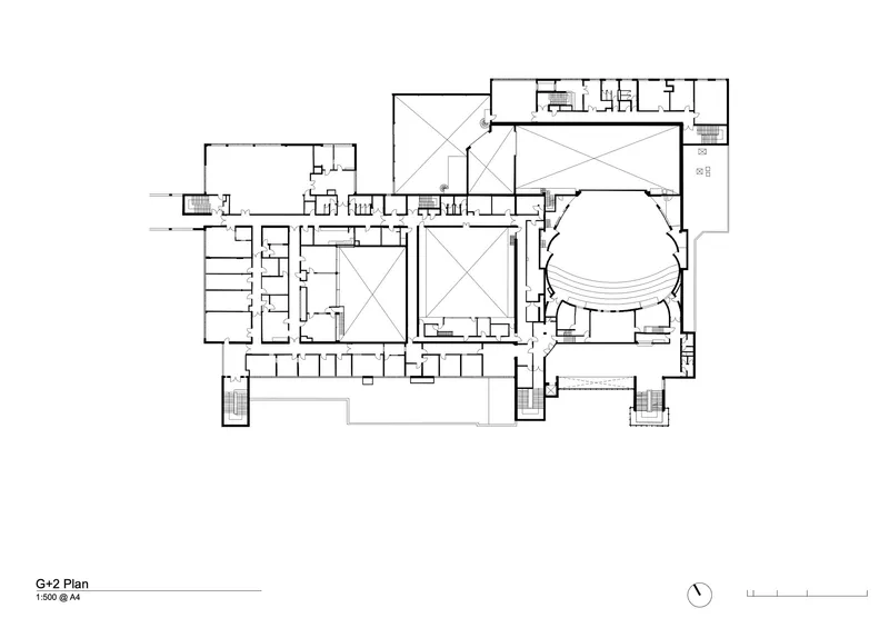 Floor plan drawing showing courtyards, a domed auditorium on the right, and rectangular wings extending to the left