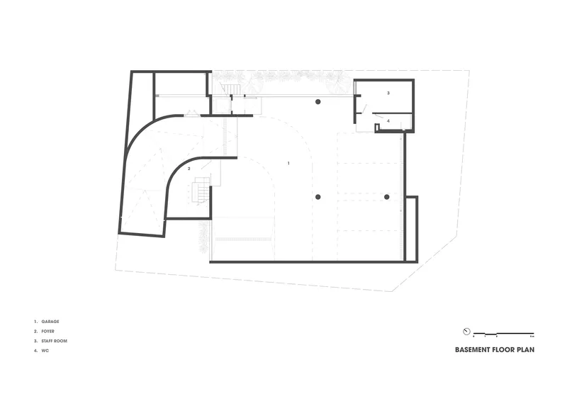 Basement floor plan drawing with curved exterior wall and central staircase serving garage and storage spaces