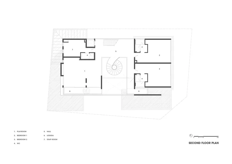 Second floor plan drawing with central spiral staircase connecting bedrooms and service areas across two wings