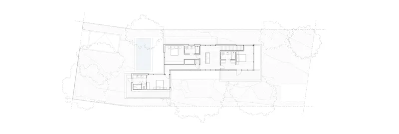 Floor plan drawing showing upper level with bedrooms, kitchen and staircase adjacent to pool below
