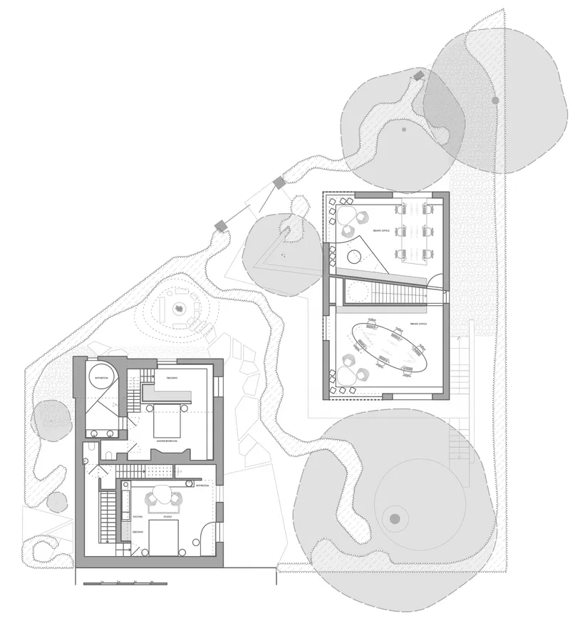 Upper floor plan showing office spaces and terraces within the sloping landscape