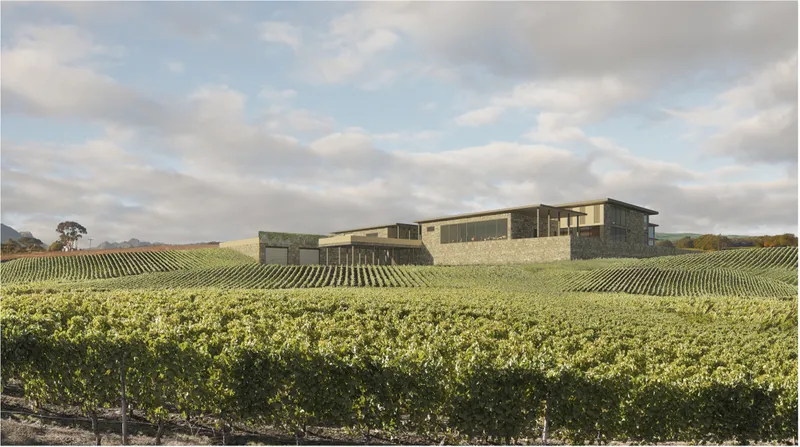 Winery complex integrated seamlessly within expansive vineyard landscape