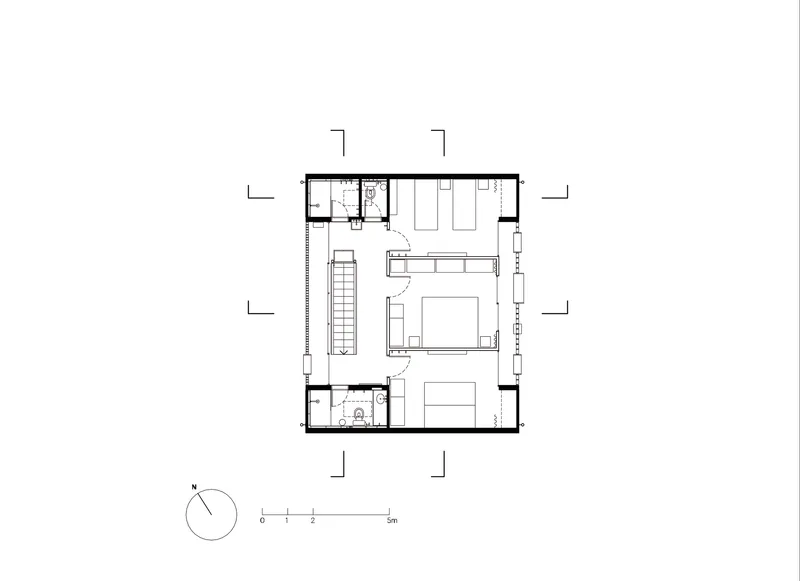 Second floor plan showing bedroom suite with double bed and twin bathrooms flanking central stair