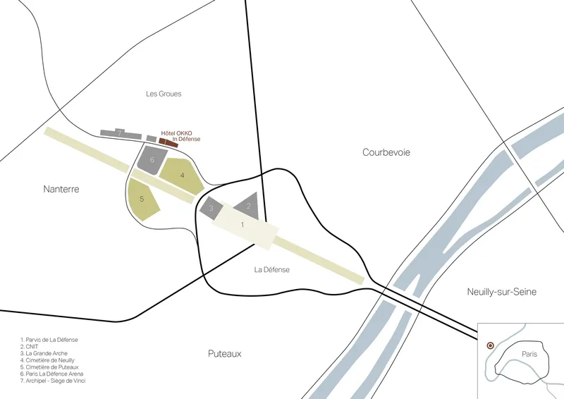 Site plan drawing showing multiple building zones along a river with roads and surrounding districts
