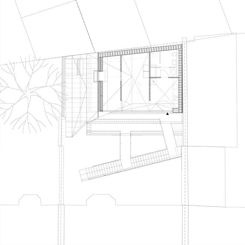 Top floor plan drawing showing an attic space with diagonal staircase and adjacent street trees