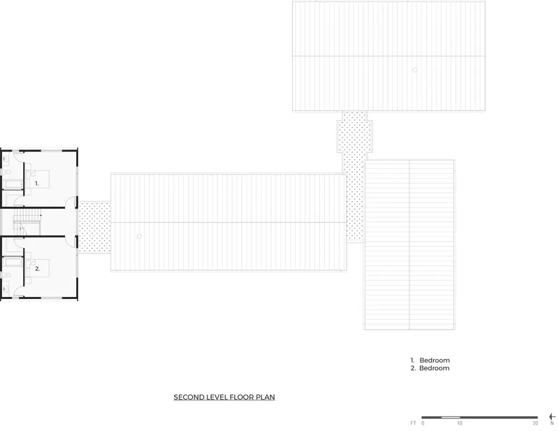 Second level floor plan showing two bedrooms with adjoining deck and outdoor terrace spaces