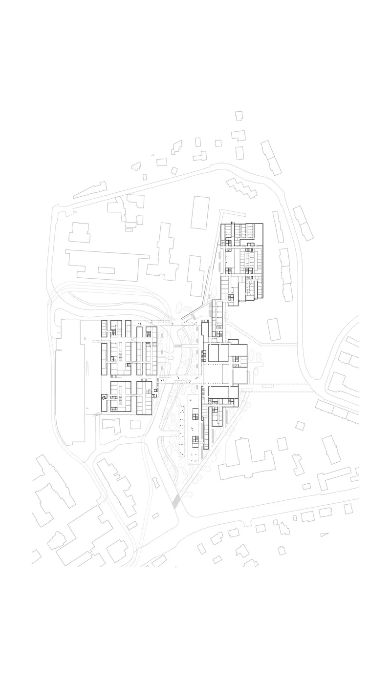 Site plan drawing showing residential blocks arranged around curving roads and landscape areas
