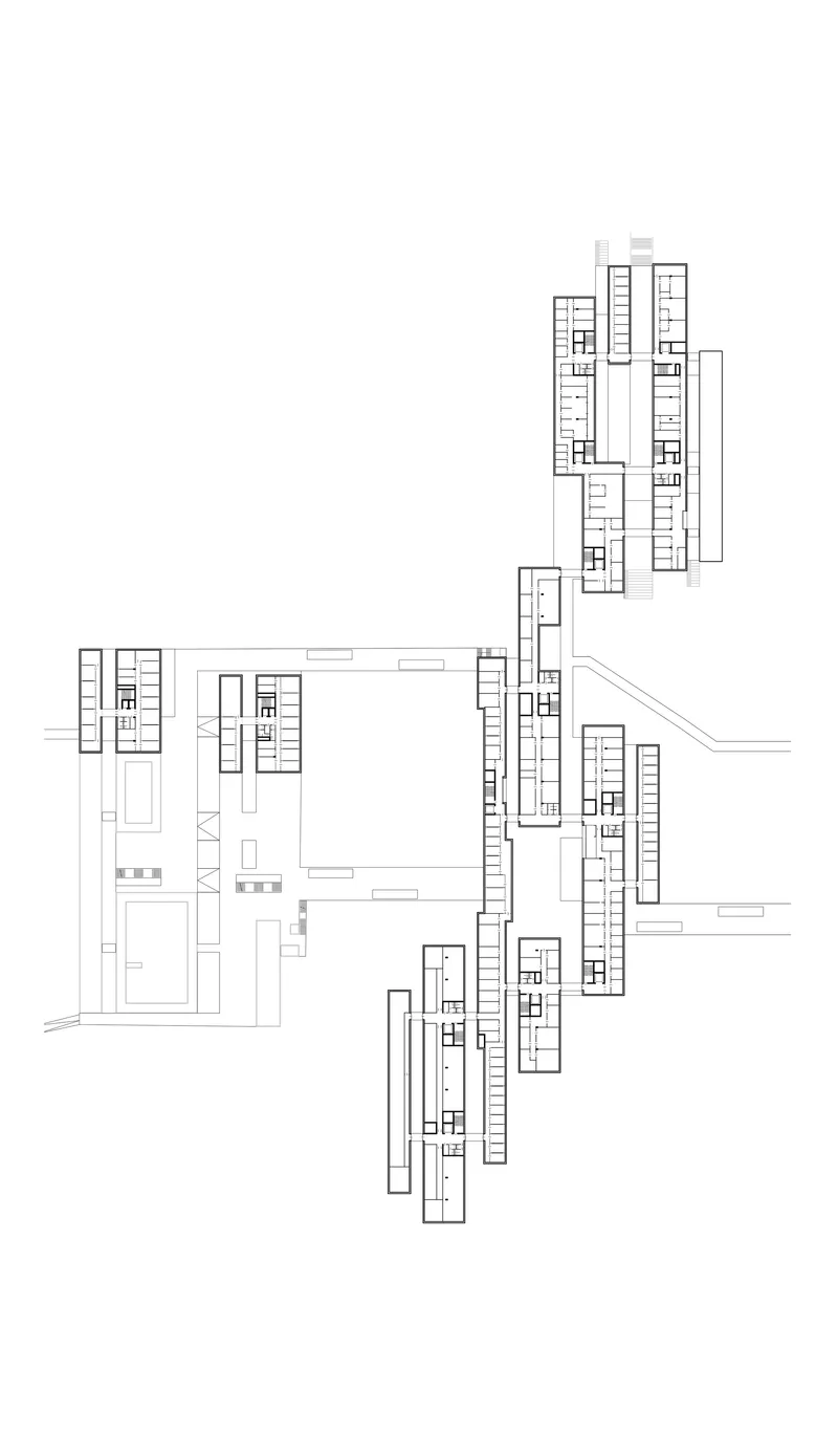 Site plan drawing showing multiple rectangular building footprints arranged in a staggered cluster formation