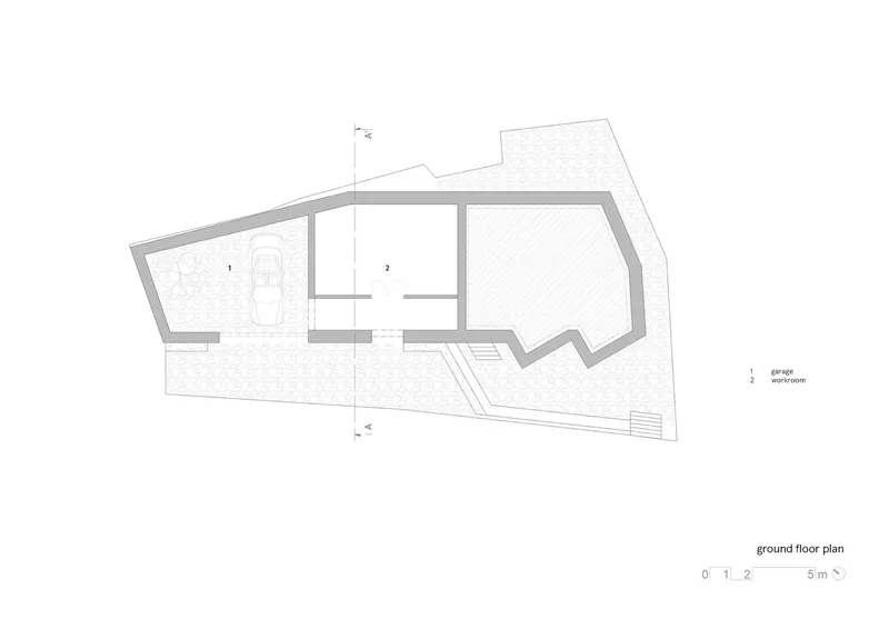 Ground floor plan drawing showing the garage and single workroom volume