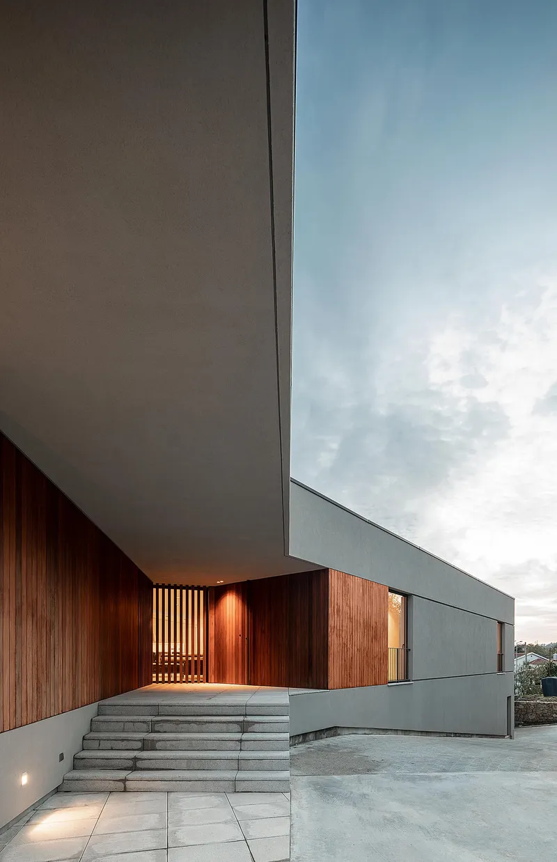 Sharp roofline articulation framing sky views and emphasizing the cantilever.