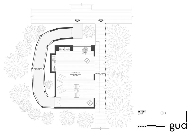 Floor plan drawing showing curved perimeter walls and central living space surrounded by trees