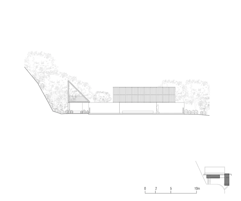 Elevation drawing showing horizontal facade with triangular glazed element and sloping site below