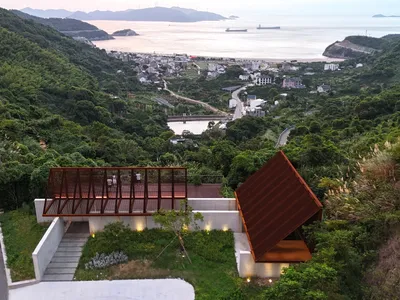 Atelier LuxNox and Found Projects Split a Gable Roof in Two to Frame the Ningbo Coast