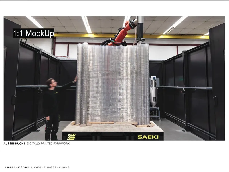 Robotic arm printing a full-scale ribbed curved wall in a fabrication workshop
