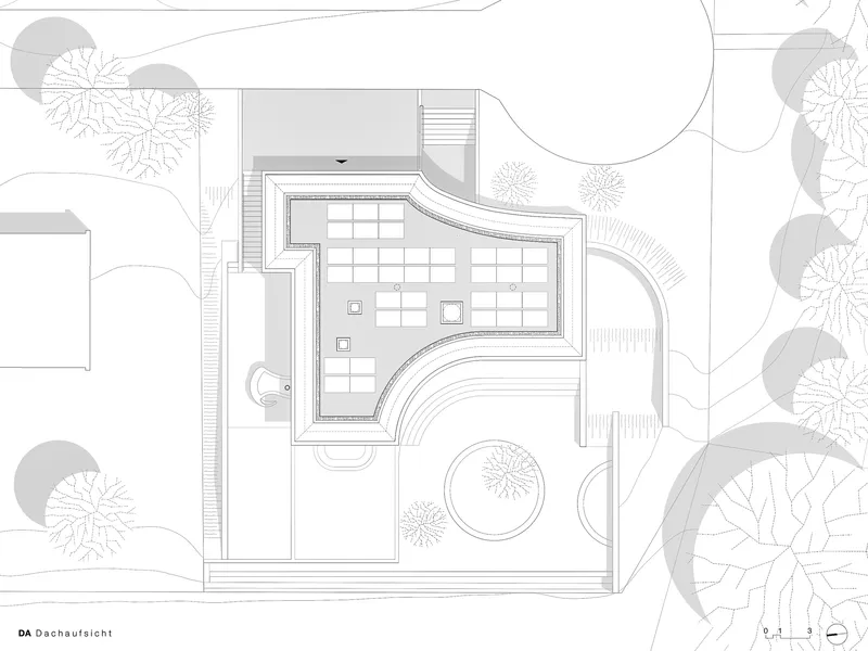 Roof plan drawing showing a curving volume with interior courtyards and surrounding landscape with trees