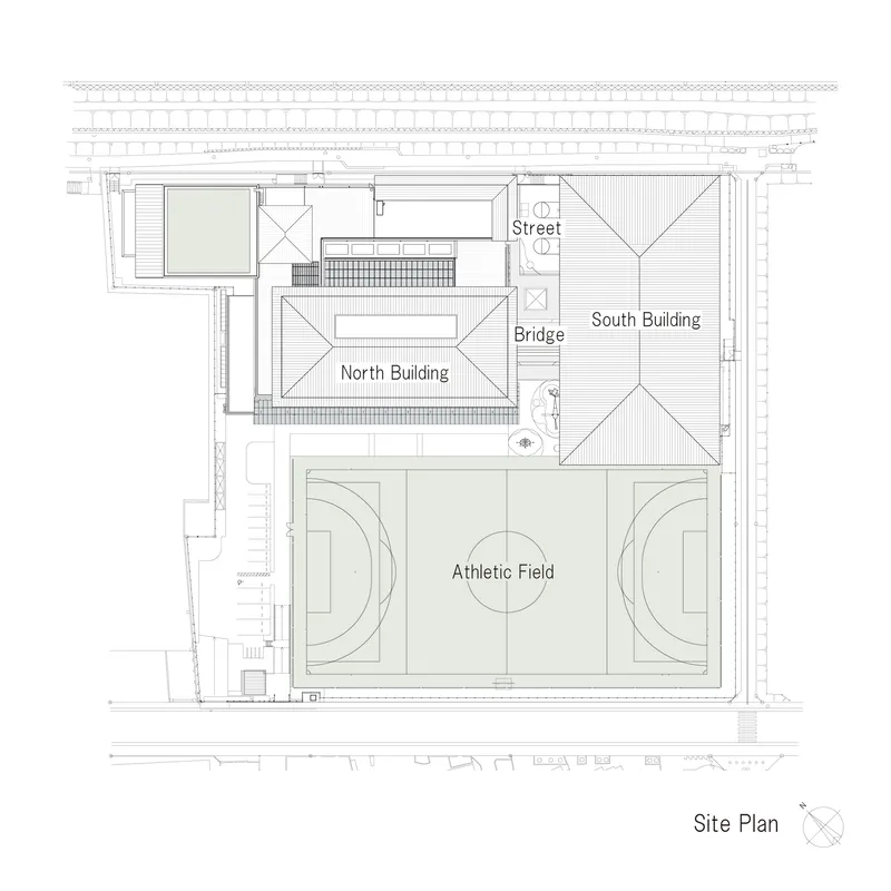 Site plan drawing showing two buildings flanking an athletic field and connected by a bridge