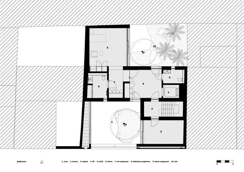 Floor plan drawing showing multiple rooms arranged around two internal courtyards with circular tree planters