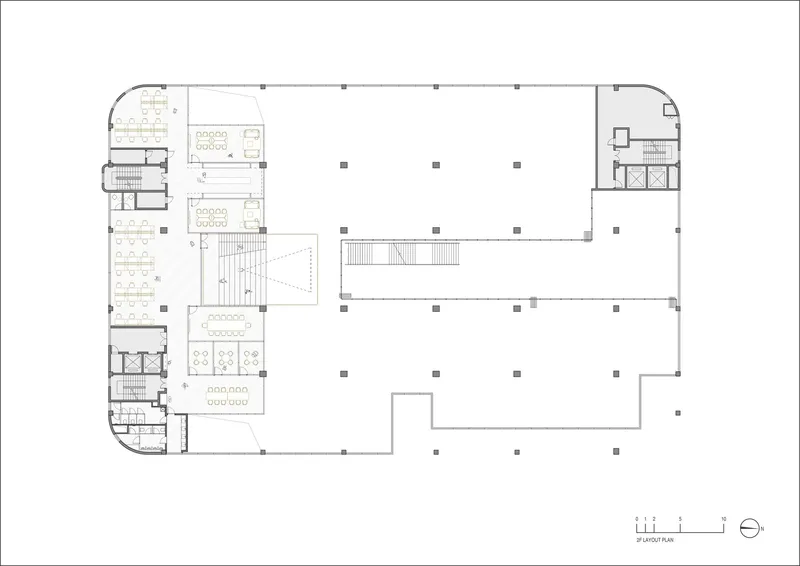 Floor plan showing open office areas with conference rooms and a central stair void