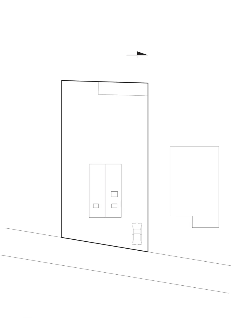 Site plan drawing showing building footprints and adjacent structures with orientation arrow