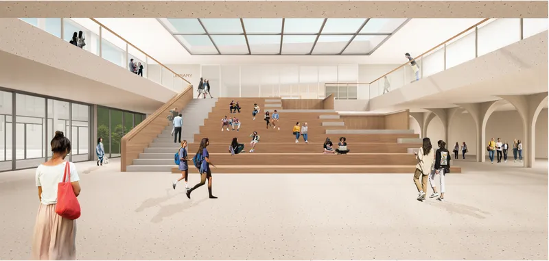 Central atrium with stepped seating encouraging collaboration, gathering, and flexible learning.