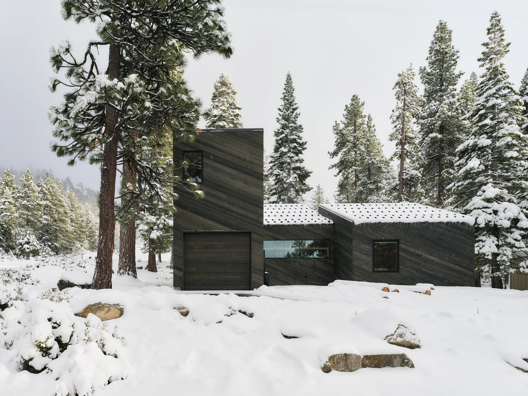Mork-Ulnes Architects Fragments a Tahoe Cabin into Four Shed-Roofed Volumes That Step Down a Forested Slope