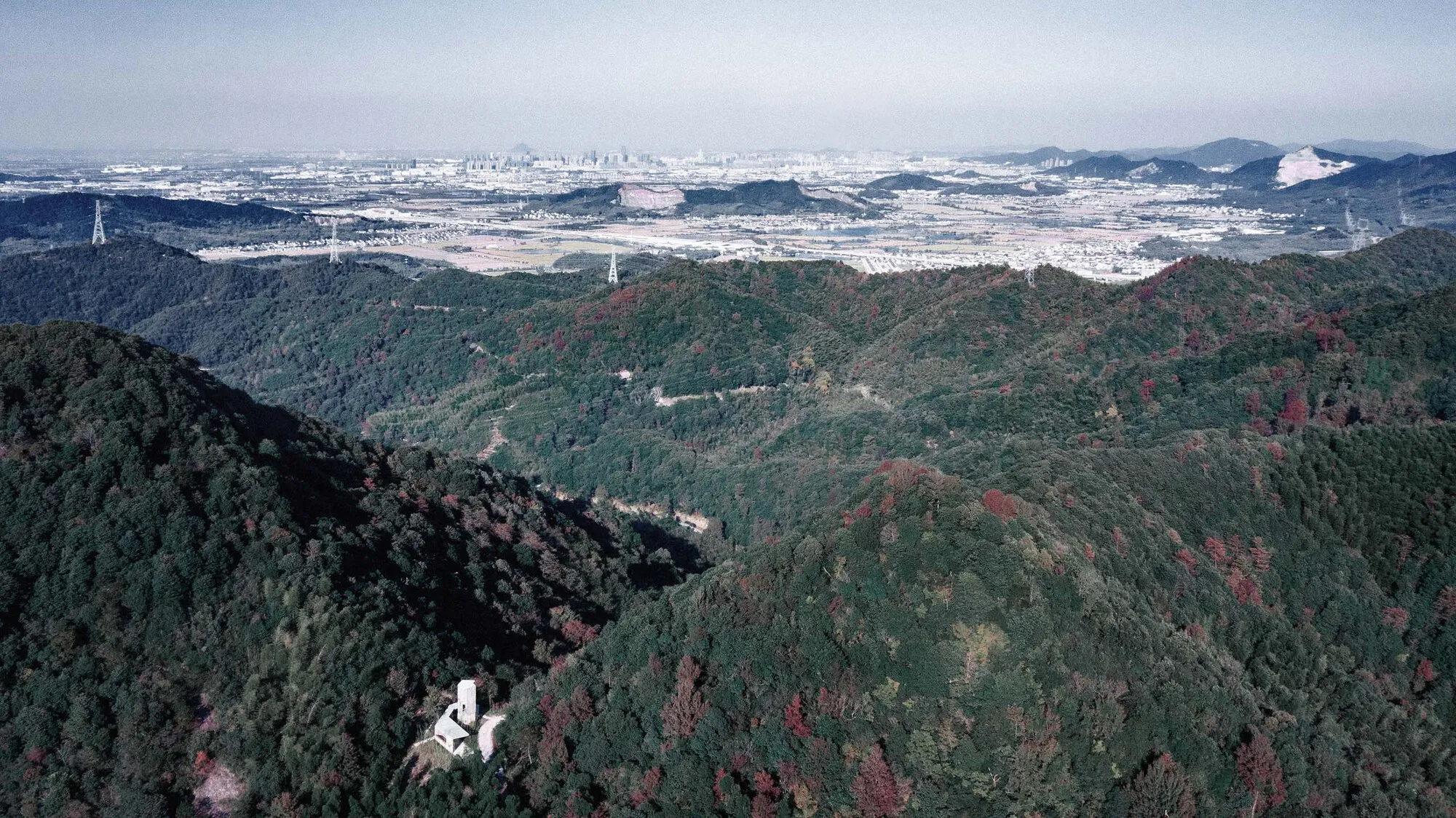 Jumping House Lab Spirals a Concrete Tower Above the Treetops for Mountaintop Cyclists