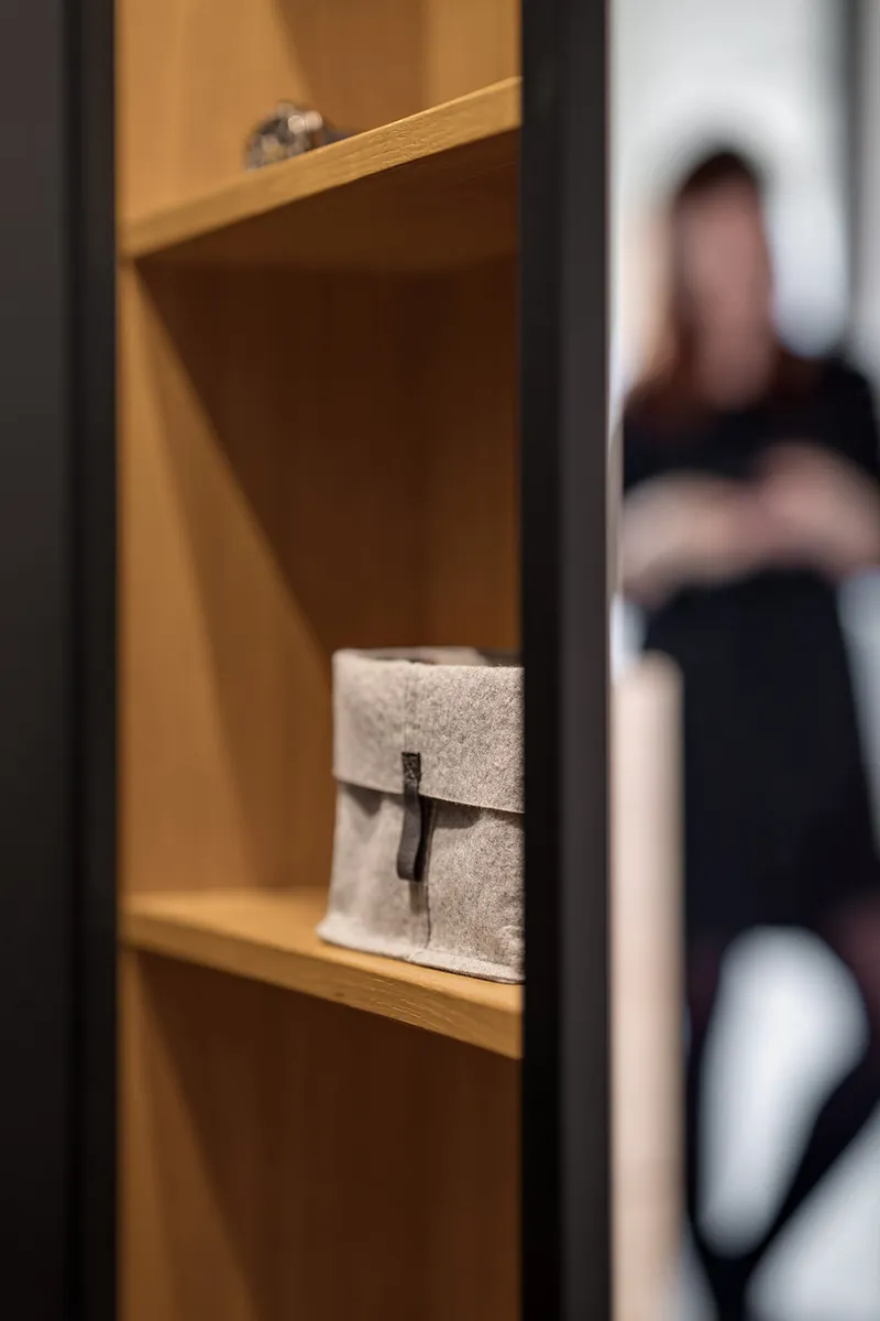 Detail of custom shelving highlighting craftsmanship and material contrast